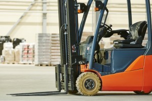 An empty warehouse forklift stacker ready for a trained operator and basic operations.